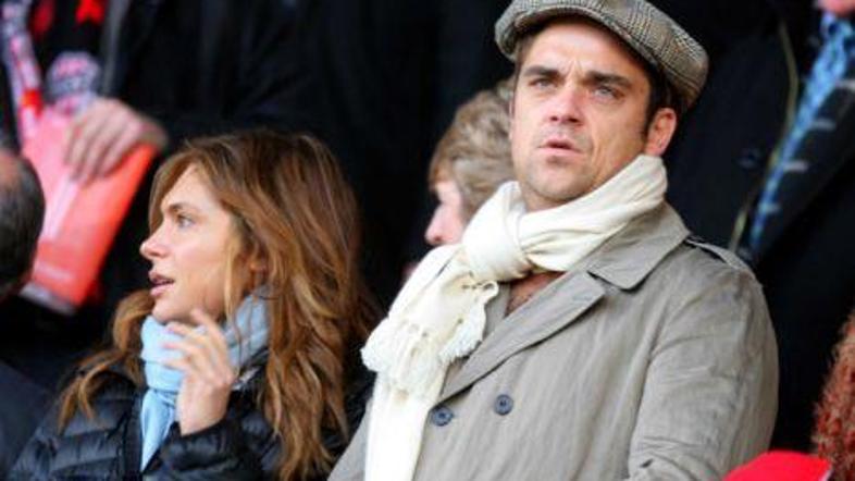 Robbie Williams in igralka Ayda Field sta par že tri leta. (Foto: Mark Leich)