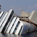 razno 12.09.13. The capsized cruise liner Costa Concordia lies surrounded by cra