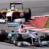 Michael Schumacher (Mercedes) in Adrian Sutil (Force India)