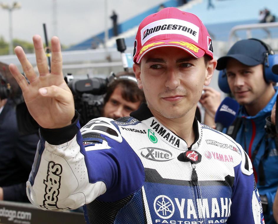 Bo Jorge Lorenzo tudi po dirki veselo mahal s štirimi prsti? (Foto: Reuters)