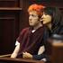 James Holmes po pokolu prvič na sodišču.