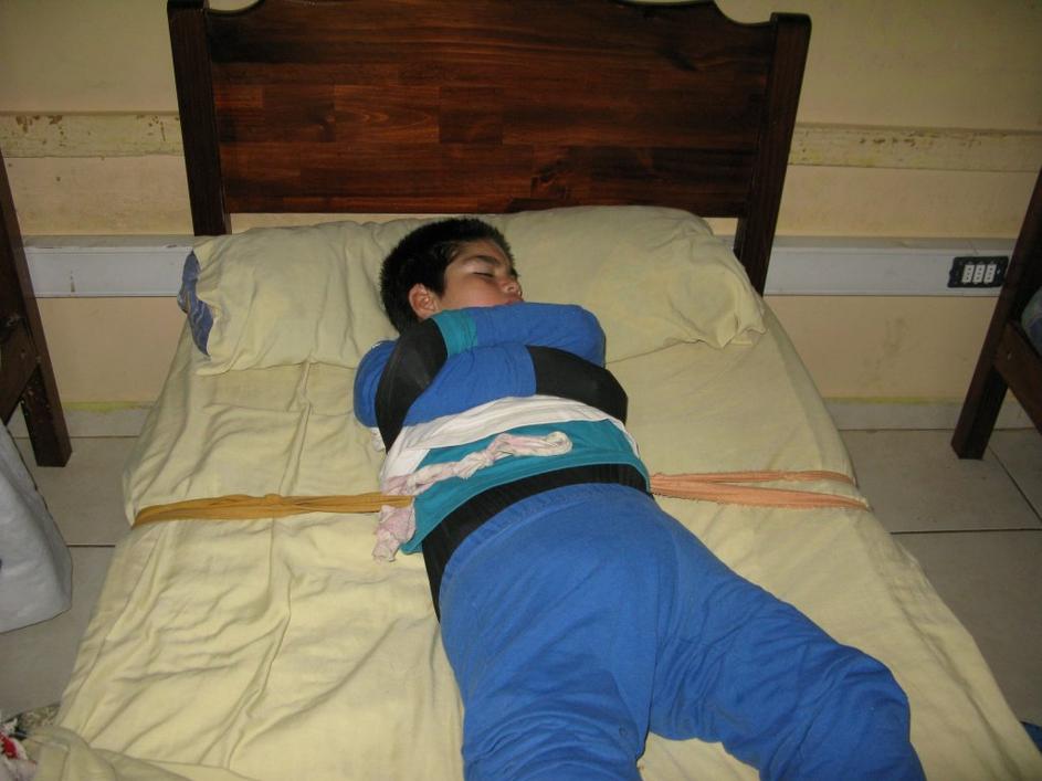 Man Tied To Bed