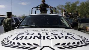 Soldiers use a pickup truck of the local municipal police in San Fernando, in th