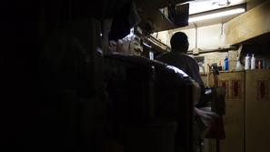 razno 07.02.13. revscina, Peng, a 61-year-old man, reads newspapers on a bed he 