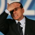 Italian Prime Minister Silvio Berlusconi gestures as he makes a speech during a 