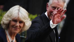 razno 12.11.13. Britain's Prince Charles (R) and his wife Camilla arrive for a p
