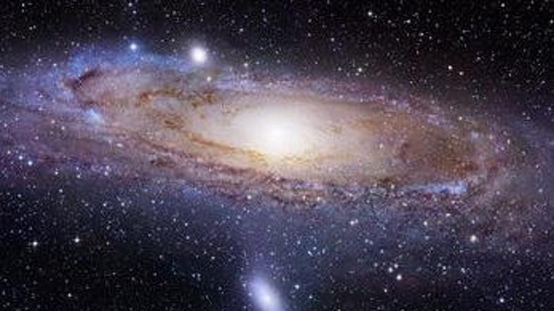 Galaksija Andromeda se še vedno širi in pri tem požira druge.