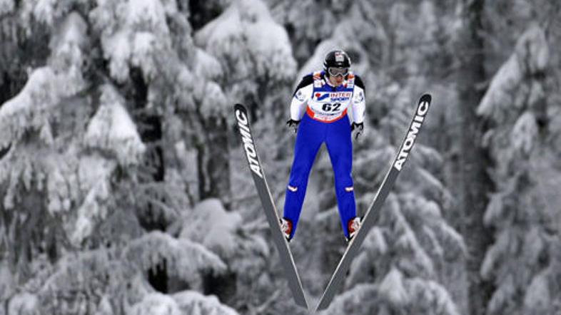Wolfgang Loitzl je SP začel z zlato kolajno.