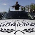 Soldiers use a pickup truck of the local municipal police in San Fernando, in th