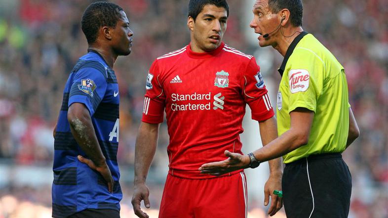 Luis Suarez naj bi z rasističnimi zmerljivkami napadel Patrica Evraja