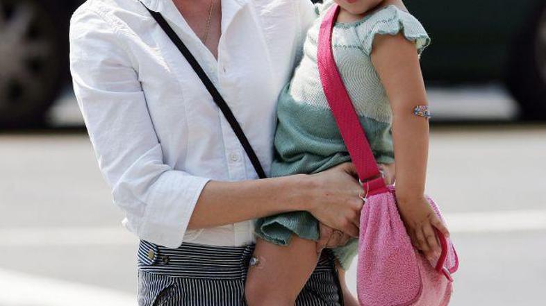 Michelle bi rada ohranila spomin na nekoč srečno družino.