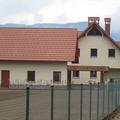 Nadomestna stanovanjska hiša z gospodarskim poslopjem za družino Vovk v Lescah j