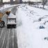 Vozniki v Chicagu so morali svoja vozila pustiti kar v snegu.