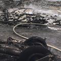 Letalo je po nesreči povsem razpadlo, večina ga je zgorela. (Foto: Reuters)