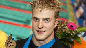 Takole je Steffen Deibler poziral z medaljo. (Foto: Reuters)