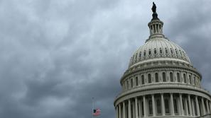 razno 05.01.14. ameriski kongres, A U.S. flag flies at half-staff under gray ski