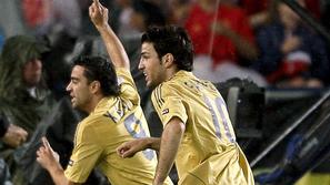 Xavi (levo) in Fabregas (desno) utegneta v prihodnosti skupaj zaigrati tudi v kl
