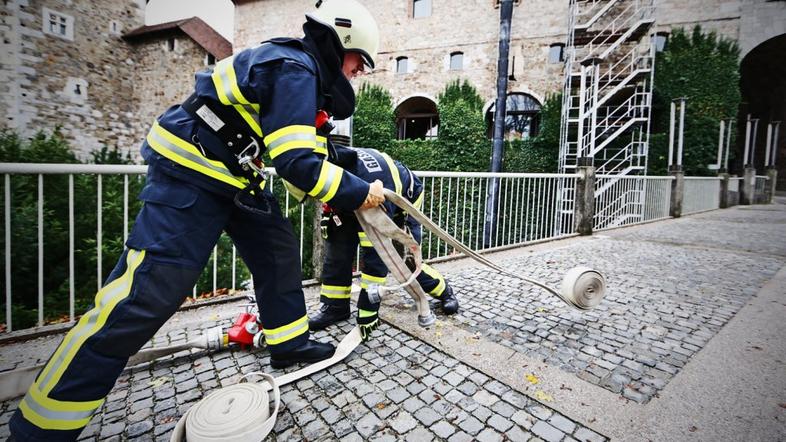 vaja reševanje gasilci evakuacija Ljubljanski grad napad