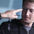 Interviewer James Bennet points to an audience member as Facebook CEO Mark Zucke