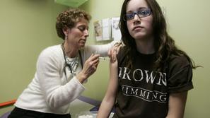 razno 12.09.13. HPV cepljenje, Nancy Brajtbord, RN, (L) administers a shot of ga