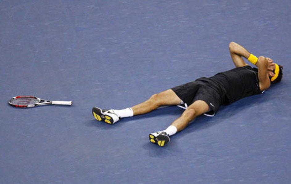 Padel je na hrbet in se tresel od razburjenja. Juan Del Potro. Več fotografij sl