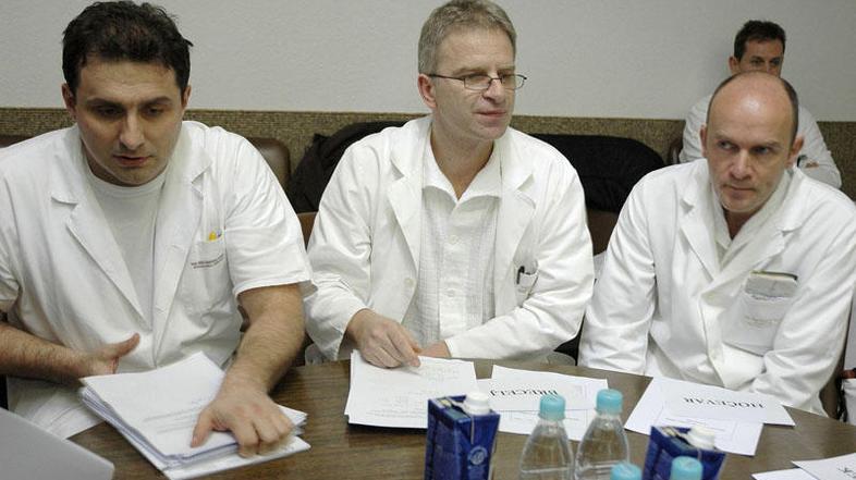 Erik Brecelj (levo) in Marko Hočevar (desno) na seji sveta. (Foto: Dejan Mijovič