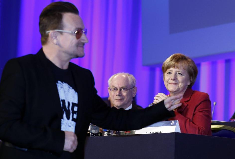 Bono in Angela Merkel