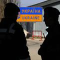 razno 26.03.14. Ukrainian border guards stand at a Russian-Ukrainian border cros