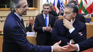 razno 22.11.12. Hungary's Prime Minister Viktor Orban (R) watches as Greece's Pr