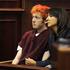 James Holmes po pokolu prvič na sodišču.